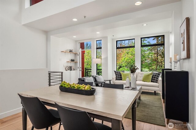 dining area featuring recessed lighting, light wood finished floors, and baseboards