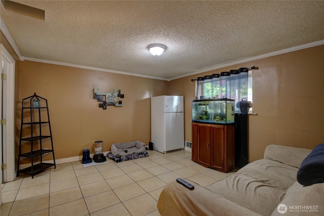 living area featuring crown molding, a textured ceiling, and light tile patterned floors