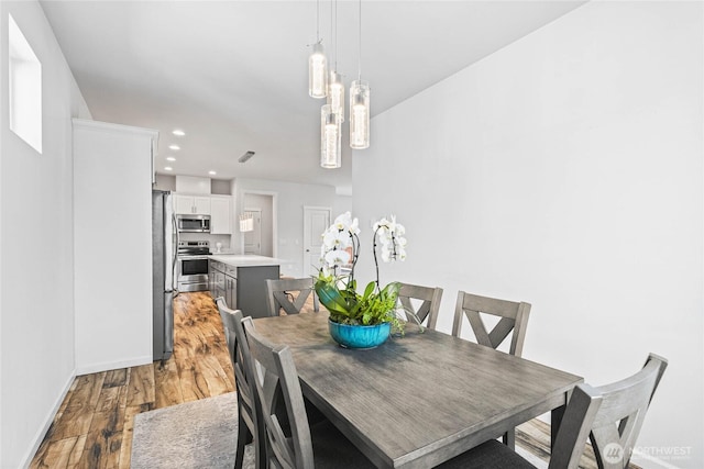 1824 E Fairbanks St, Tacoma, WA 98404 - dining space featuring light wood-type flooring, baseboards, recessed lighting, and a chandelier