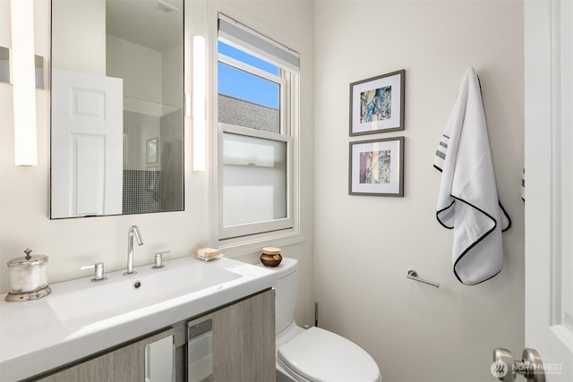 full bathroom with a sink, toilet, and a shower