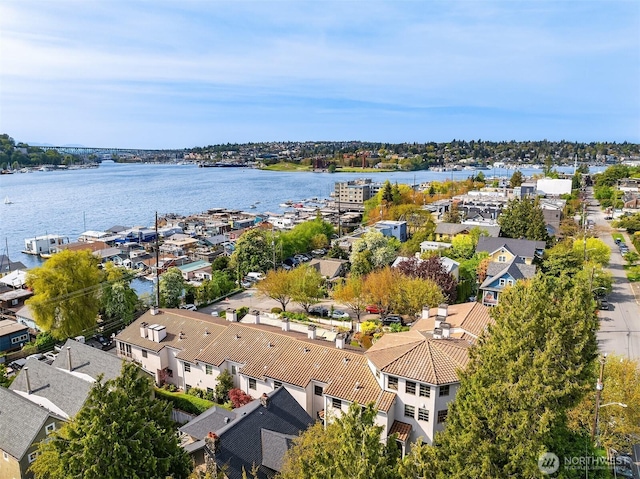 birds eye view of property with a water view and a residential view