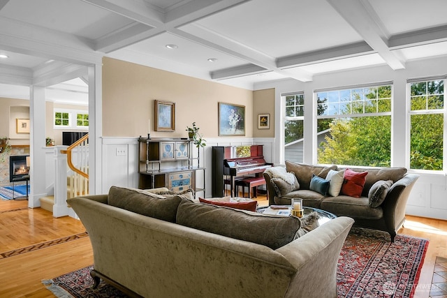 7854 Stroud Ave N, Seattle, WA 98103 - living area featuring coffered ceiling, a wainscoted wall, beamed ceiling, light wood-style floors, and stairs