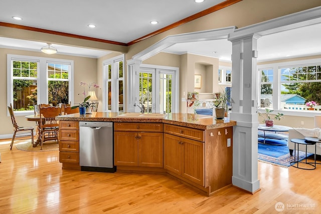7854 Stroud Ave N, Seattle, WA 98103 - kitchen with a sink, brown cabinets, light wood-style floors, and dishwasher
