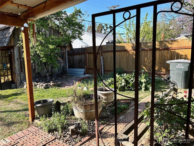 view of yard with a fenced backyard