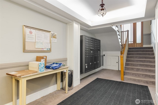 interior space with stairs and mail area