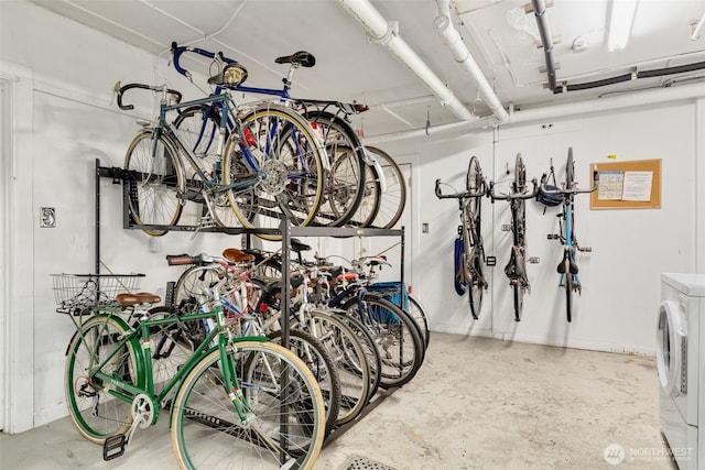 garage featuring bike storage and washer / clothes dryer