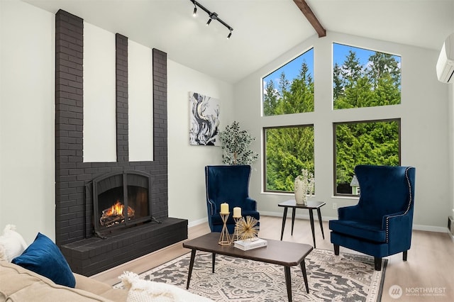 living area featuring a wall mounted air conditioner, a fireplace, high vaulted ceiling, wood finished floors, and beamed ceiling