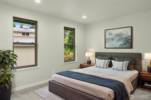 bedroom featuring carpet floors, multiple windows, baseboards, and recessed lighting