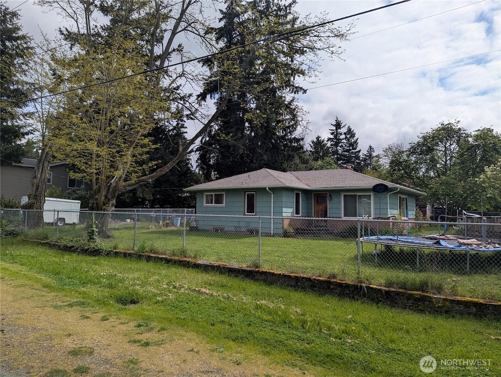 exterior space with a lawn and a fenced backyard