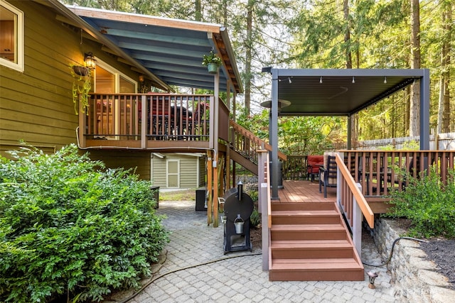 deck featuring stairway and a patio area