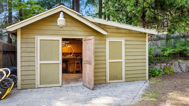 view of shed with fence