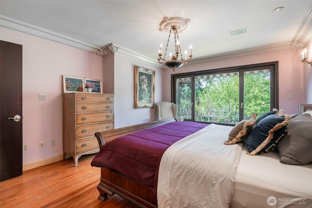 bedroom with crown molding, baseboards, a chandelier, and light wood-style flooring