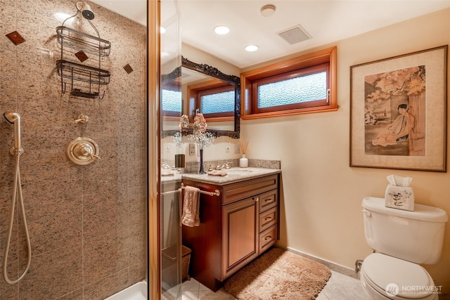 full bath featuring vanity, toilet, tile patterned floors, a shower stall, and visible vents
