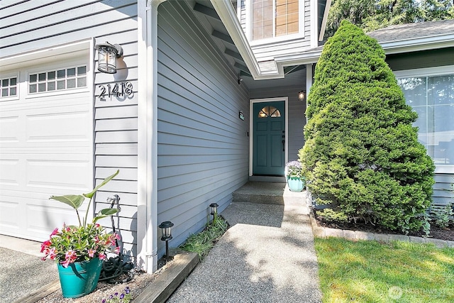 doorway to property with an attached garage
