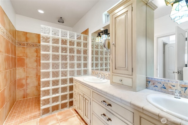 10910 48th Street Ct E, Edgewood, WA 98372 - full bath featuring a walk in shower, double vanity, and tile patterned floors