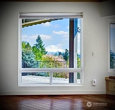 10910 48th Street Ct E, Edgewood, WA 98372 - doorway with healthy amount of natural light and wood finished floors