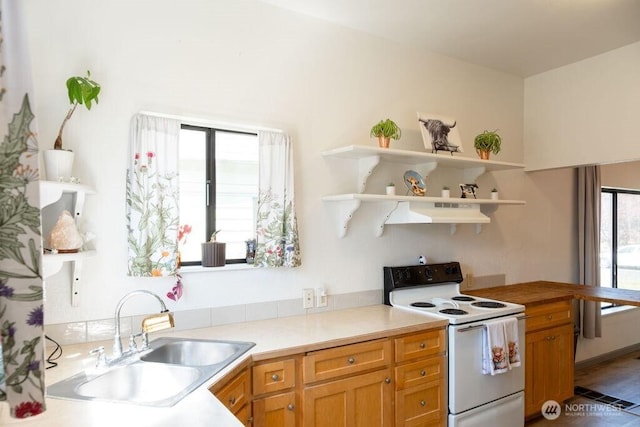 616 Pleasant St, Walla Walla, WA 99362 - kitchen featuring open shelves, white electric range, light countertops, under cabinet range hood, and a sink