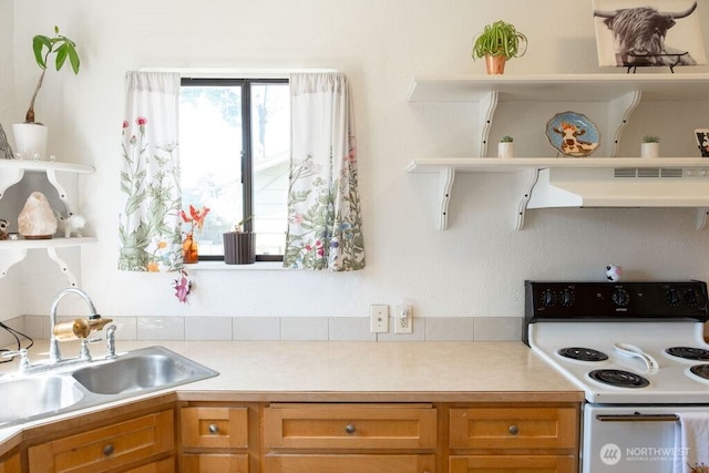 616 Pleasant St, Walla Walla, WA 99362 - kitchen featuring white electric stove, open shelves, a sink, light countertops, and under cabinet range hood