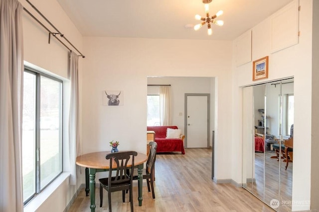 616 Pleasant St, Walla Walla, WA 99362 - dining room featuring light wood-style floors, baseboards, and a chandelier