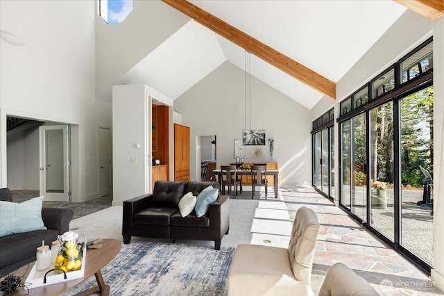 living room with beam ceiling and high vaulted ceiling