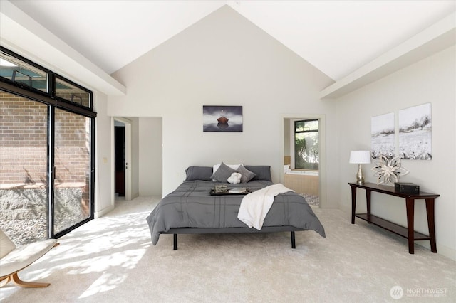 bedroom featuring high vaulted ceiling, light colored carpet, and access to exterior