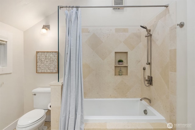 full bath featuring visible vents, tiled shower / bath combo, and toilet