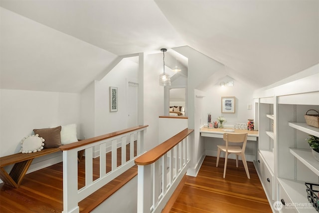 interior space featuring vaulted ceiling and wood finished floors