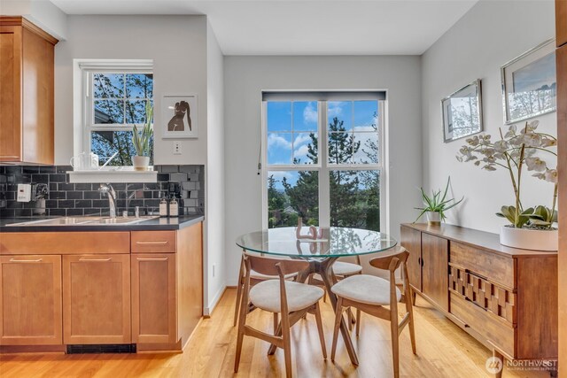 dining area with light wood finished floors