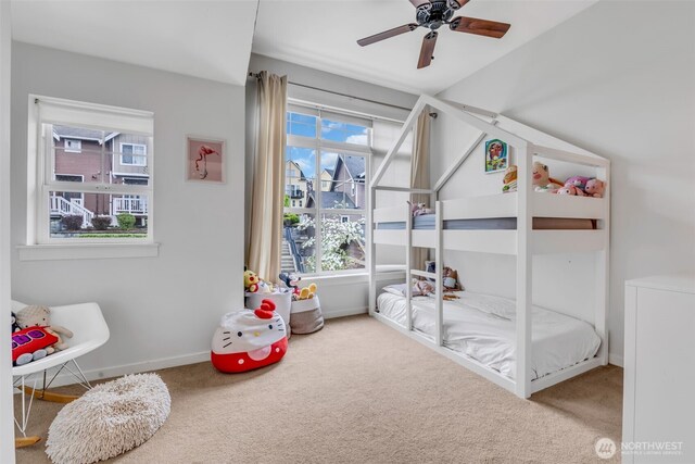 carpeted bedroom with baseboards