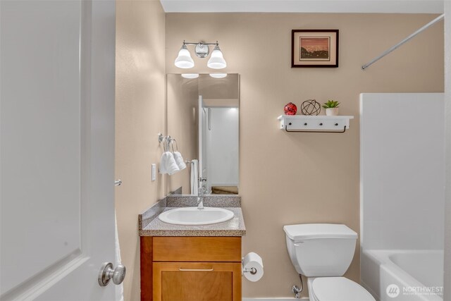 full bath with vanity, bathing tub / shower combination, and toilet