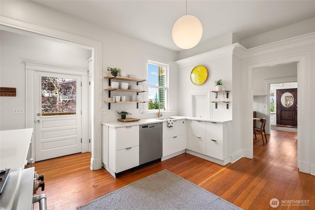 kitchen featuring wood-type flooring, stainless steel appliances, and open shelves