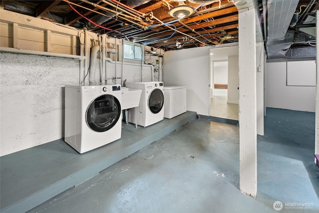 laundry area with laundry area and washer and clothes dryer