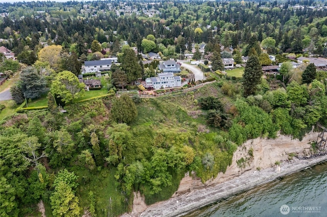 drone / aerial view featuring a water view and a residential view