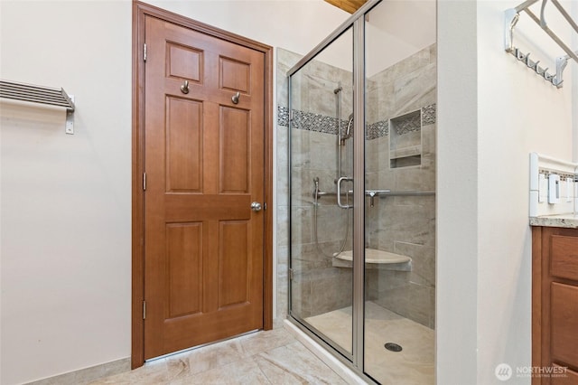 full bathroom with vanity and a stall shower