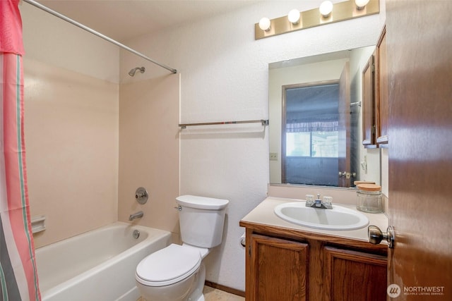 bathroom with toilet, bathing tub / shower combination, and vanity