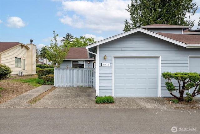 view of front of house with a shingled roof and aphalt driveway