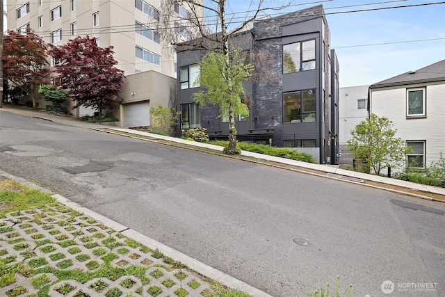 view of road featuring sidewalks and curbs