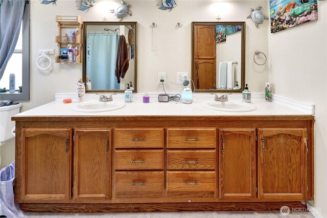 full bath featuring double vanity and a shower with curtain