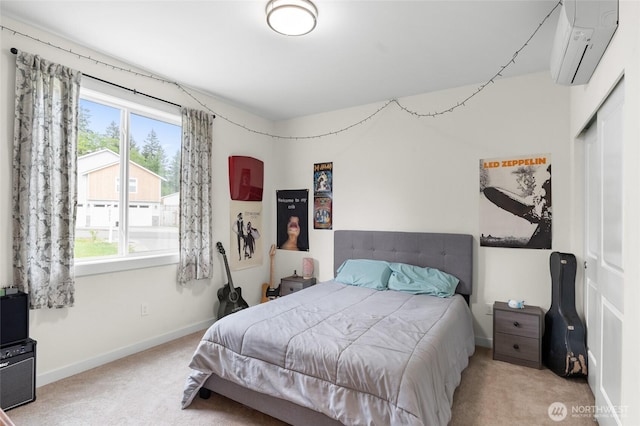 802 SE Cody St, Rainier, WA 98576 - bedroom featuring carpet flooring, a wall unit AC, a closet, and baseboards