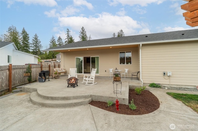 802 SE Cody St, Rainier, WA 98576 - back of house featuring an outdoor fire pit, a patio area, and fence