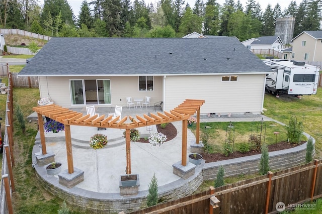 802 SE Cody St, Rainier, WA 98576 - back of property featuring a patio area, a pergola, and a shingled roof