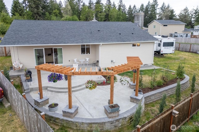 802 SE Cody St, Rainier, WA 98576 - rear view of house featuring a patio area, a pergola, a chimney, and a shingled roof