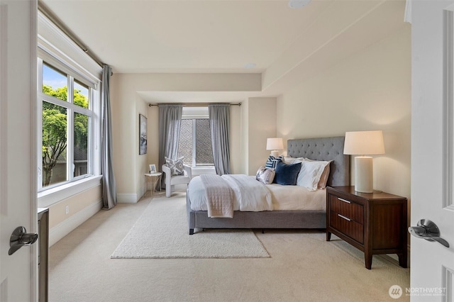 bedroom with carpet flooring and baseboards
