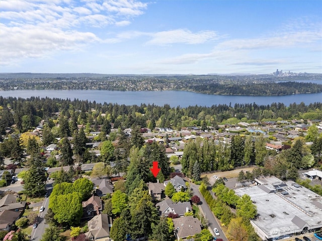 drone / aerial view featuring a water view and a residential view