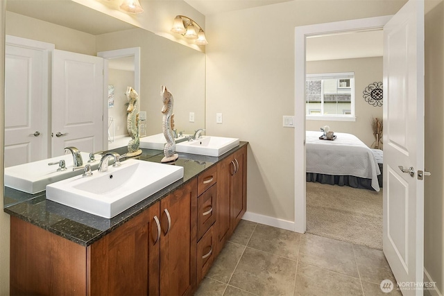 365 NE Denny Way, Issaquah, WA 98029 - ensuite bathroom with double vanity, baseboards, and tile patterned floors
