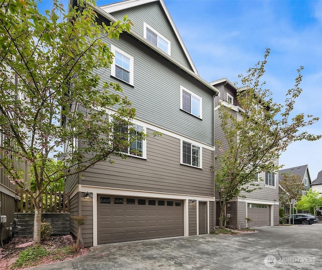 365 NE Denny Way, Issaquah, WA 98029 - view of side of home with an attached garage and driveway