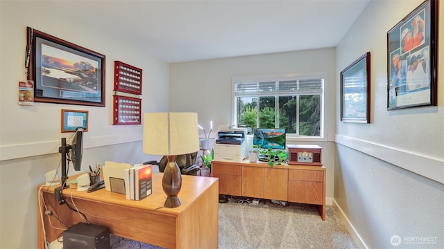 office with light colored carpet and baseboards