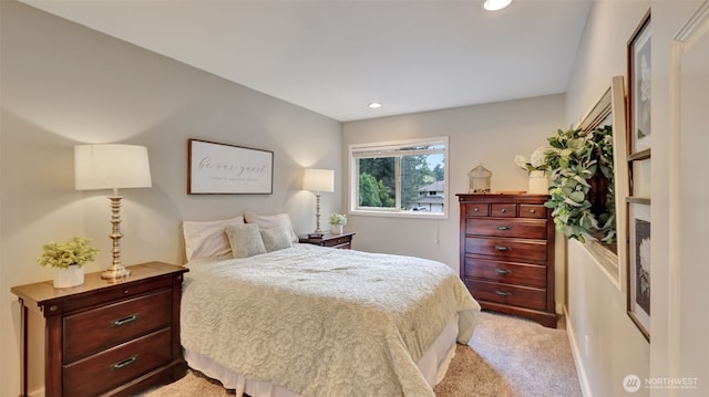 bedroom with recessed lighting and light carpet