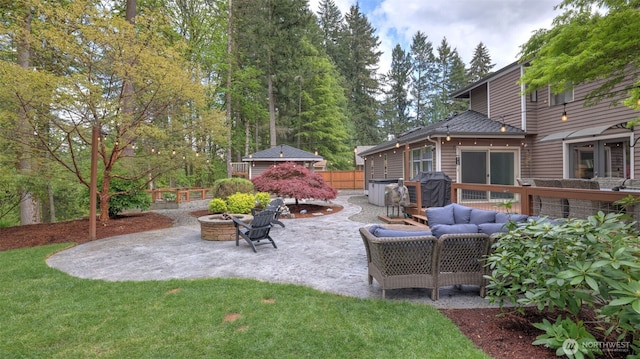 view of patio with an outdoor living space with a fire pit and grilling area