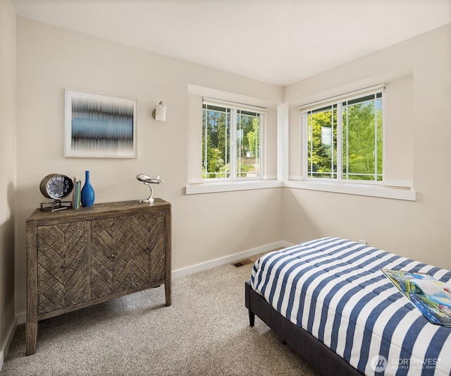 carpeted bedroom with baseboards